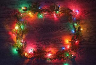 Christmas Lights Frame with Branches on Wood - Colorful Royalty-Free Stock Images and Animations at Budget Price